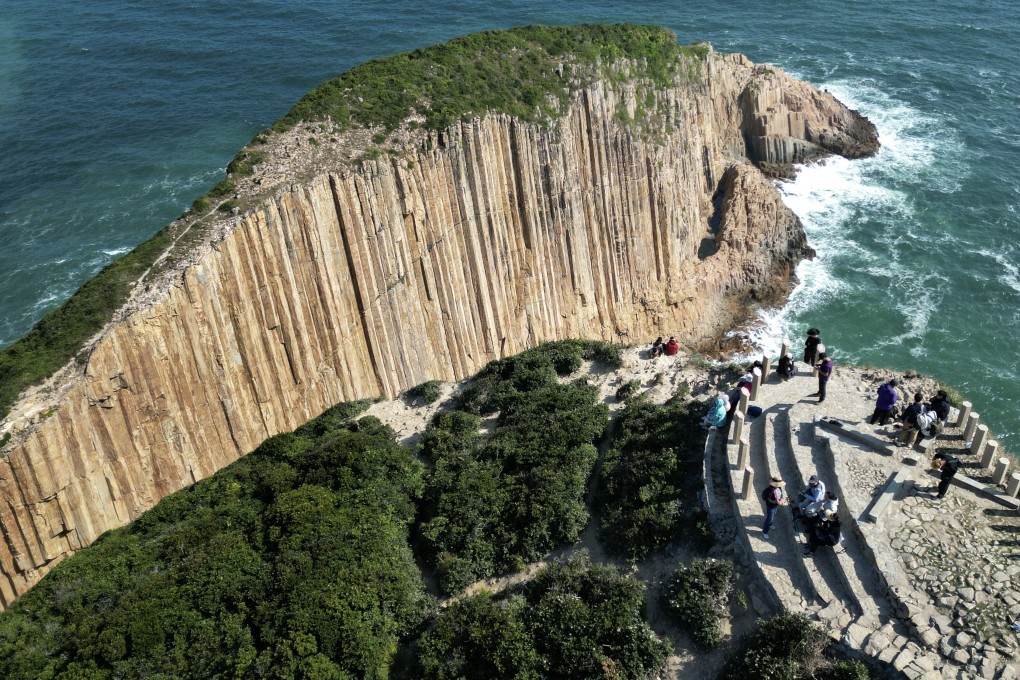 Visitors enjoy the views of Po Pin Chau – an islet known for its spectacular sea stacks and which is part of the Global Geopark. Photo: Sam Tsang