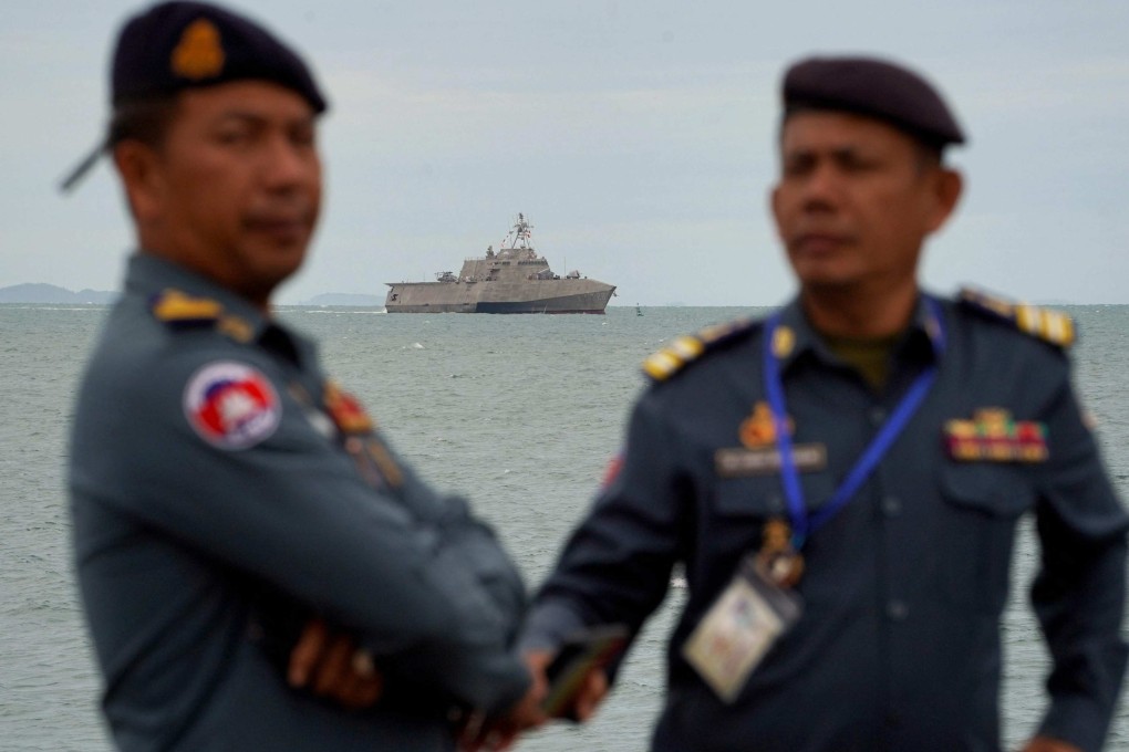 Members of the Cambodian military look on as the USS Savannah combat ship prepares to dock in Cambodia’s southern port city of Sihanoukville on Monday. Photo: AFP