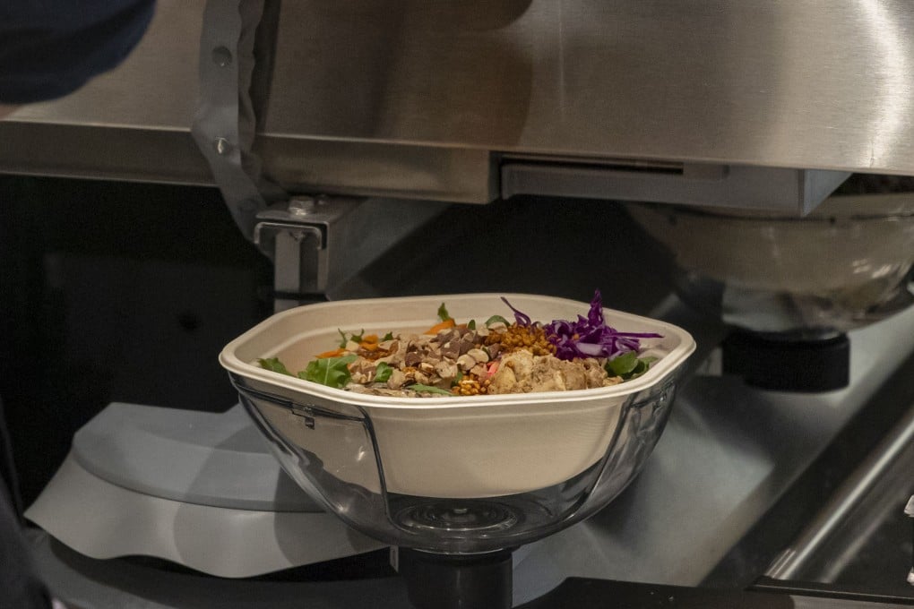 Salads come off the new Infinite Kitchen robotic system at a Sweetgreen restaurant in Chicago. The US chain is committed to rolling out automated kitchens where robots make the salads. Photo: TNS