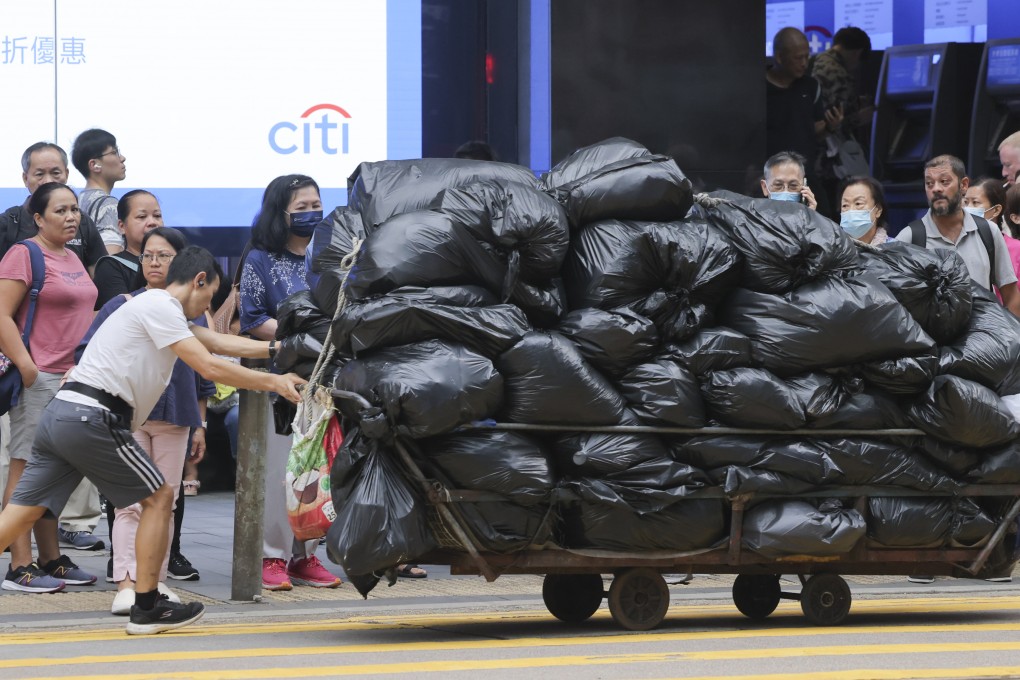 People wait to cross the road in Central in 2023. Hong Kong’s labour market has shrunk over the past couple of years. Photo: Jelly Tse