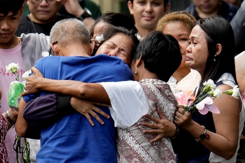 Mary Jane Veloso (centre) is embraced by her parents inside a correctional facility in the Philippines on Wednesday. Photo: Reuters
