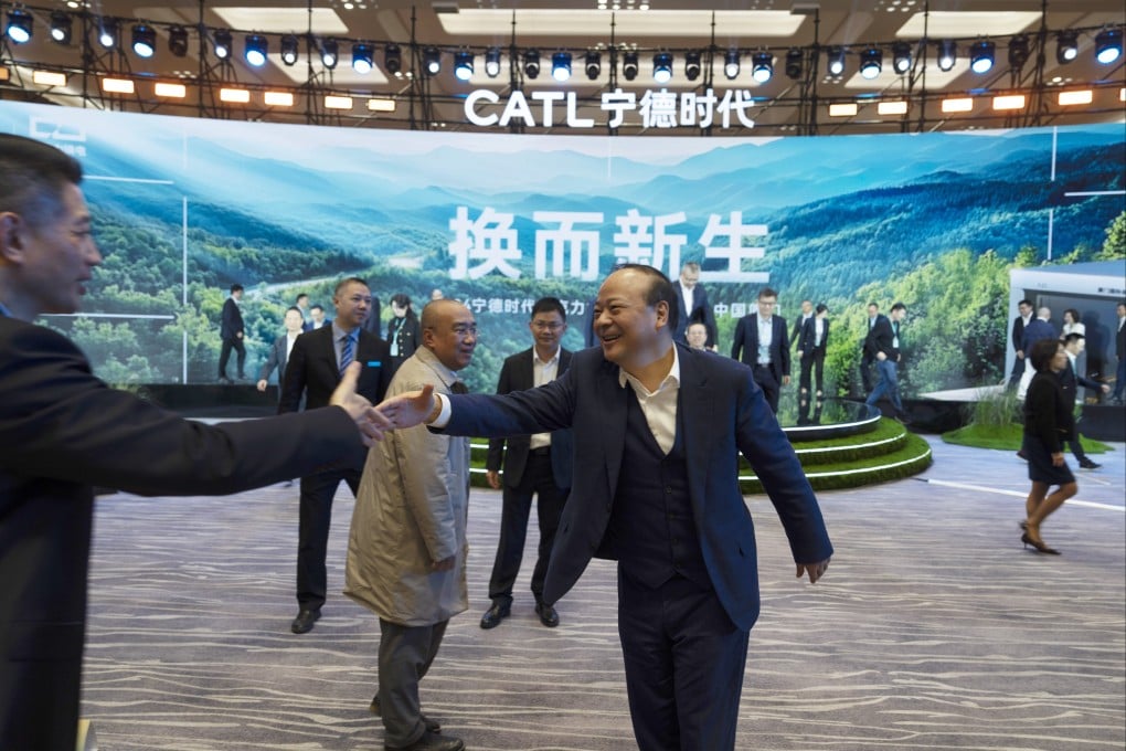 Robin Zeng, CEO of EV battery maker CATL, greets a guest after a launch event for the next generation of swap stations in Xiamen, Fujian province on December 18, 2024. AP Photo