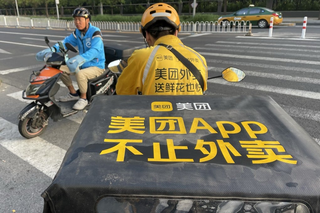 Food delivery couriers for Ele.me (left) and Meituan cross paths in Beijing on September 01, 2023. Photo: Simon Song