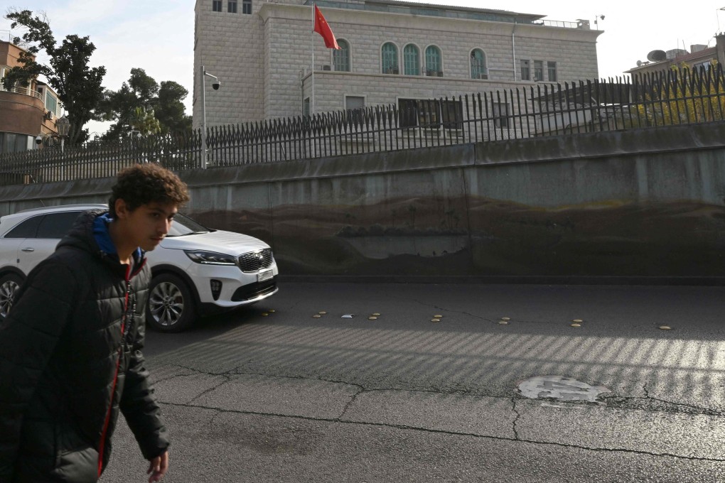 A man walks across from the embassy of China in the Syrian capital Damascus on December 12. Islamist-led rebels took Damascus in a lightning offensive on December 8, ousting Syrian president Bashar al-Assad and ending five decades of Baath rule in Syria. Photo: AFP