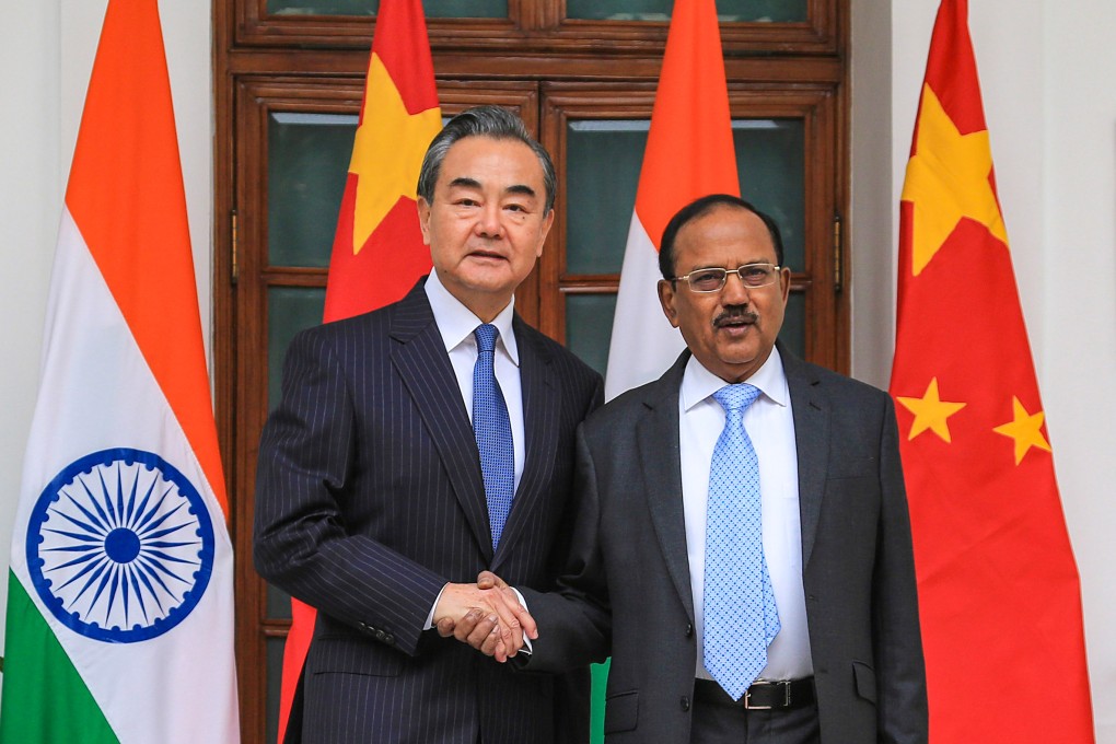 Chinese Foreign Minister Wang Yi (left) shakes hands with Indian National Security Adviser Ajit Doval in New Delhi during their December 2019 meeting on boundary issues – the last time talks were held under a high-level diplomatic mechanism that was halted after border clashes broke out in 2020. Photo: Xinhua