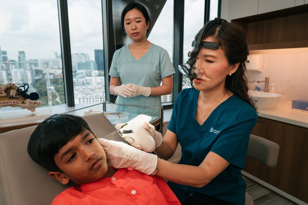 Lynne Lim demonstrating how to use the Clikx device on a patient. Our story about the Singaporean doctor’s invention was one of our most-read stories about gadgets in 2024. Photo: Cartier