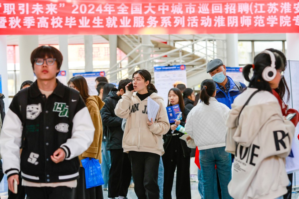 College students attend a job fair in Huai’an, a city in eastern China. More than 12 million graduates entered China’s job market this summer, pushing the nation’s youth unemployment rate up to over 18 per cent. Photo: CFOTO