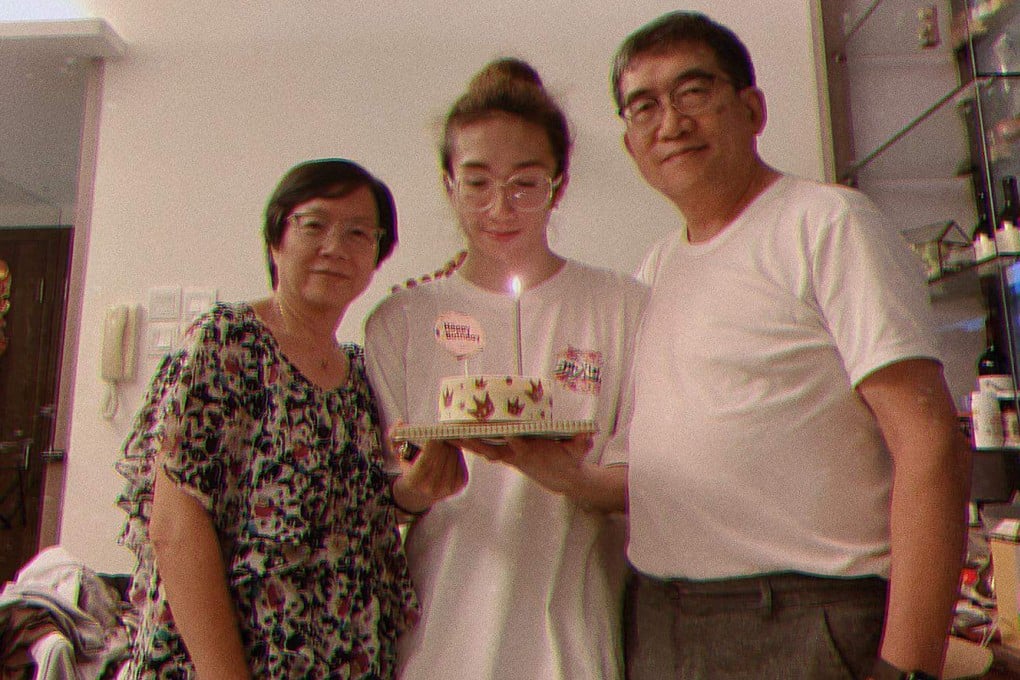 Mirror dancer Mo Li (centre) with his parents during a birthday celebration before he was seriously injured in July 2022. Photo: Instagram