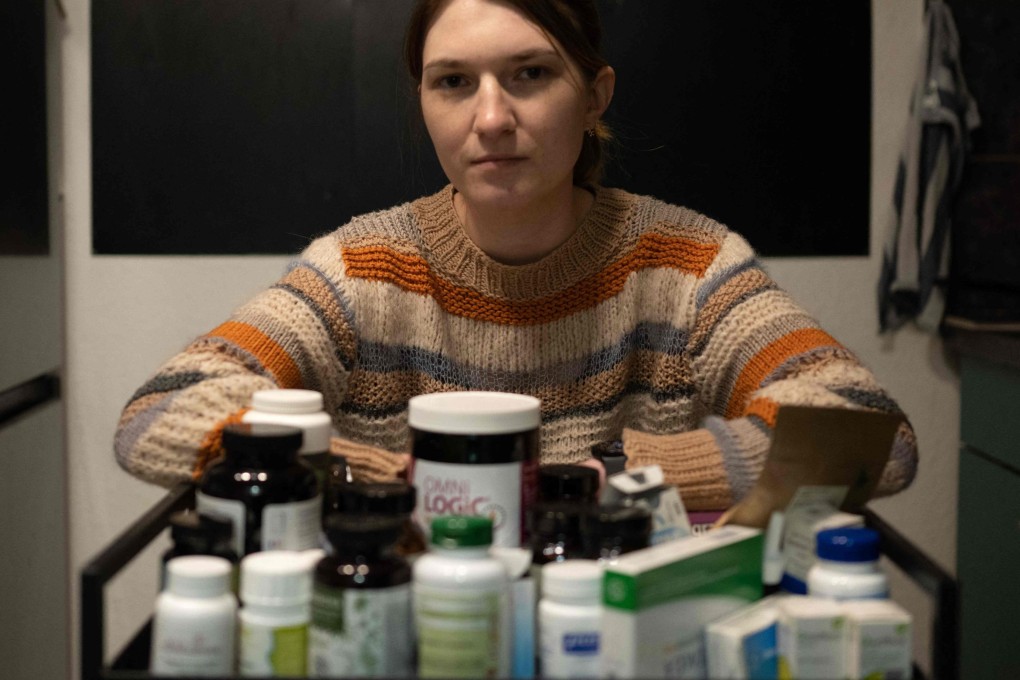 Andrea Vanek in Vienna, Austria, with medicine she takes for long Covid, a condition in which patients fail to recover fully from the acute phase of Covid infection. Photo: AFP