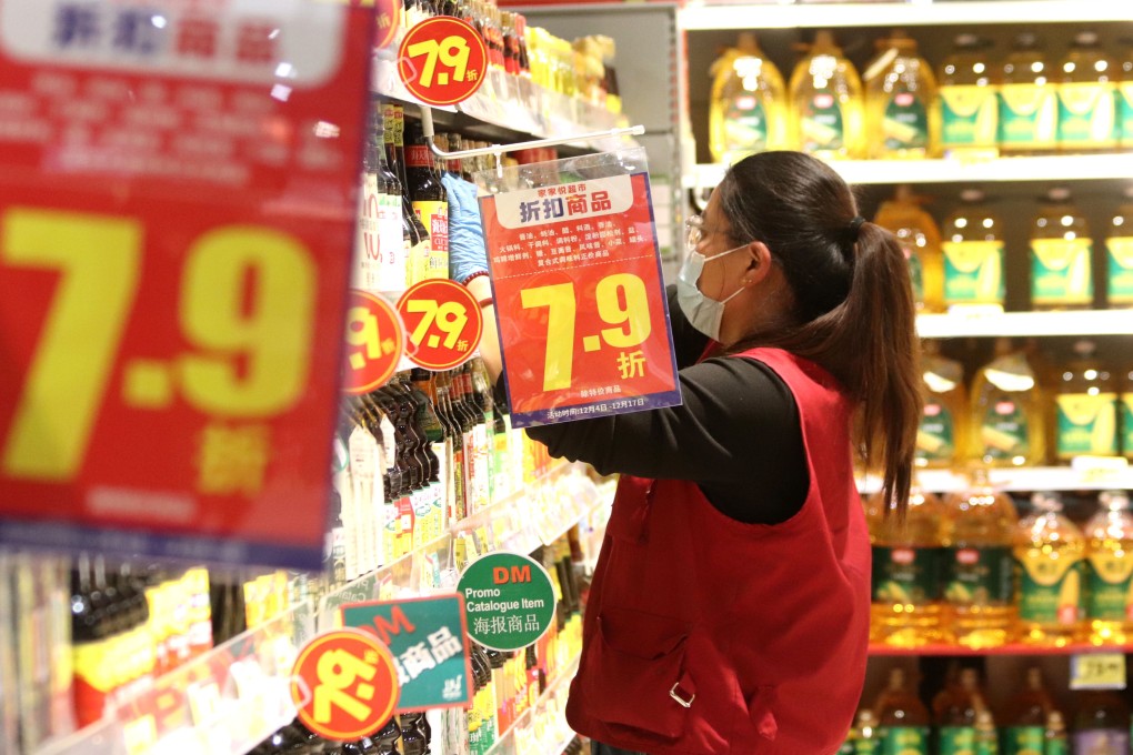 An employee checks the shelves at a supermarket in Gaomi, in eastern Shandong province, on December 16. Photo: Xinhua