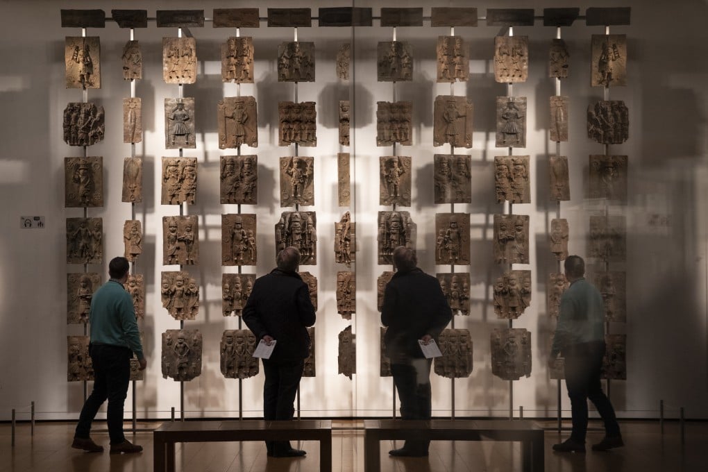Plaques that form part of the Benin Bronzes, which were taken from Africa by British troops in 1897, on display at The British Museum in London. Photo: Getty Images