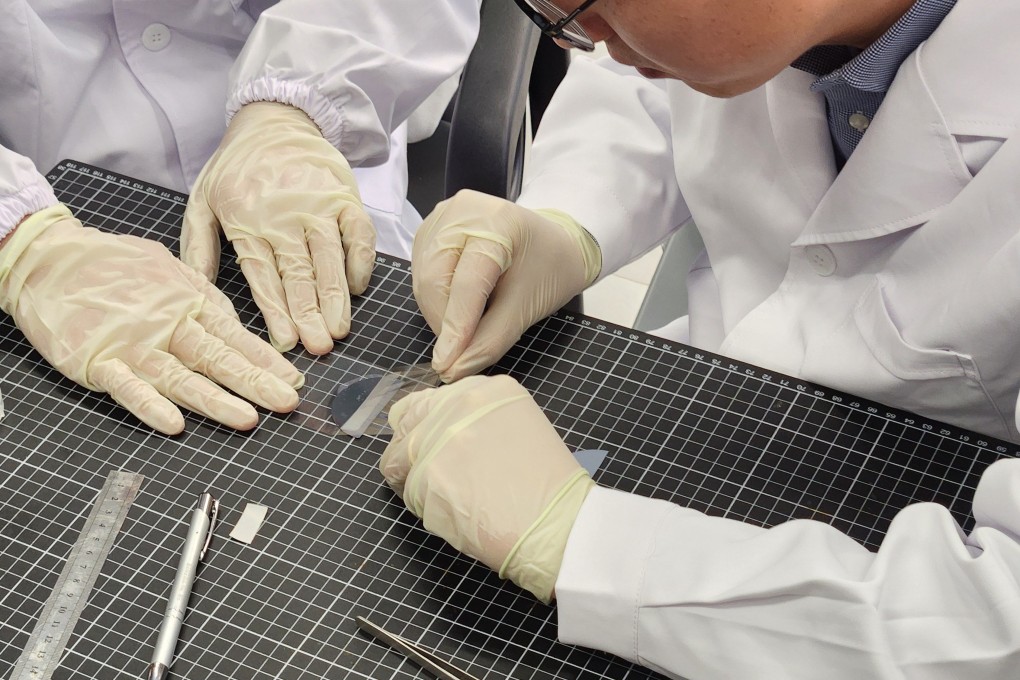 The diamond membrane is separated from a silicon substrate using tape. Photo: Holly Chik