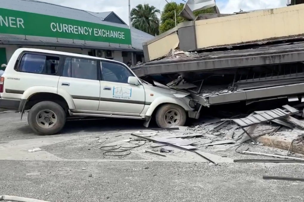 A vehicle is trapped beneath a collapsed building following a strong earthquake in Port Vila, Vanuatu on December 17/ Photo: Jeremy Ellison/Reuters