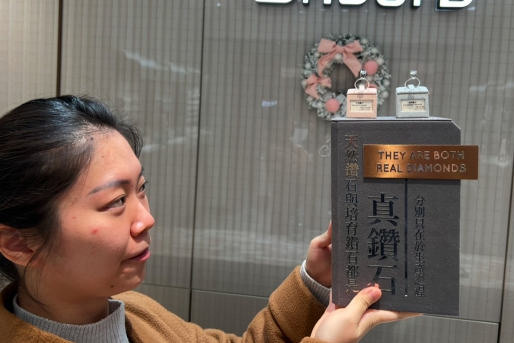Diabond marketing manager Maisy Wong displays two diamonds, one synthetic and one natural, at one of her stores in Hong Kong, December 17, 2024. Photo: SCMP
