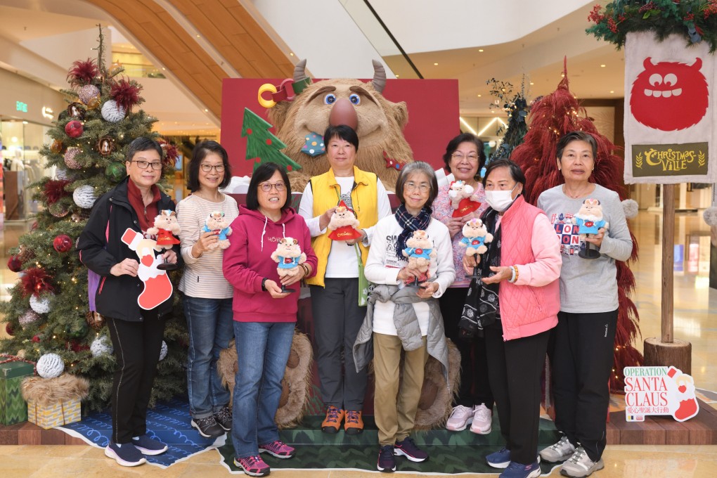 Members of the Methodist Epworth Village Community Centre learn how to make monster-themed tote bags, charms and wreaths at ChristmasVille in Pacific Place. Photo: Lam Lui-kong