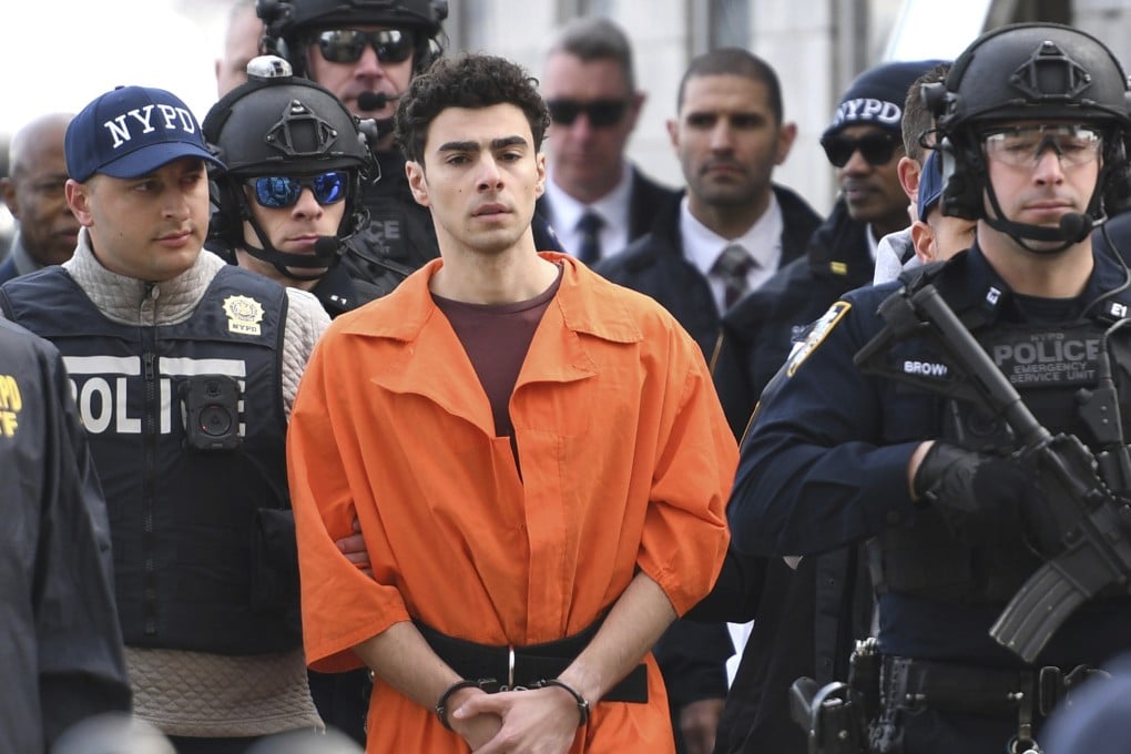 Luigi Mangione, a suspect in the fatal shooting of UnitedHealthcare CEO Brian Thompson, is escorted by police in New York on Thursday. Photo: AP