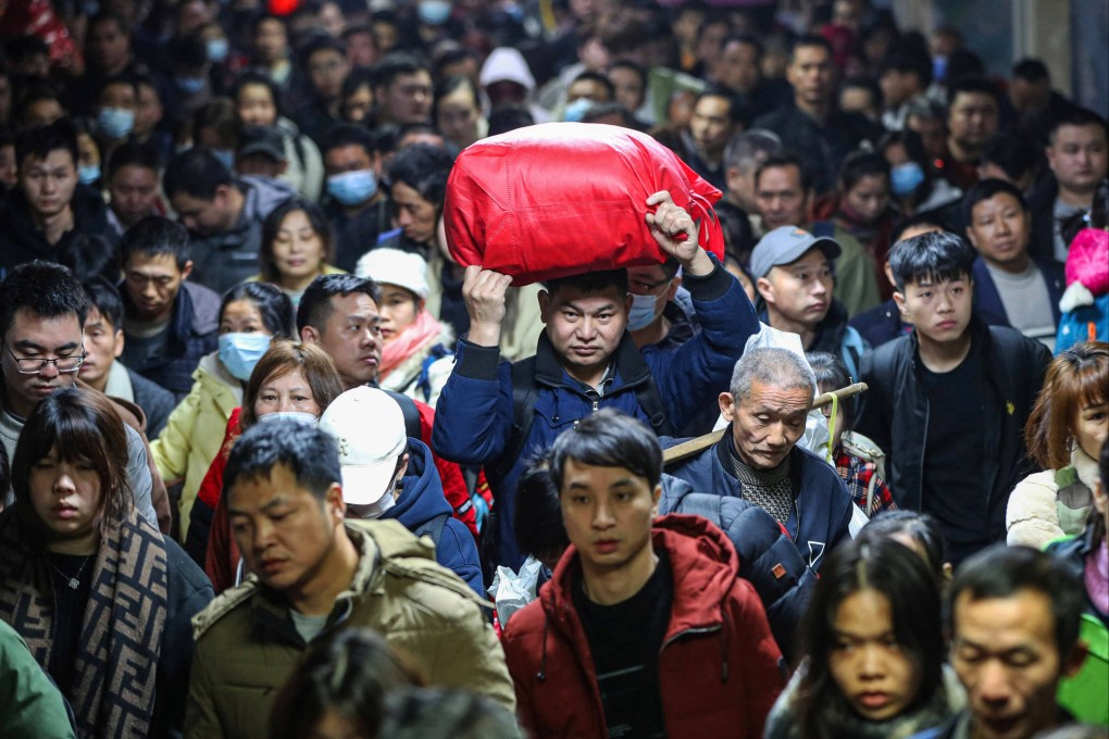 Passengers stream into a train station in central China’s Hunan province during the Lunar New Year travel rush in January 2024. Photo: AFP