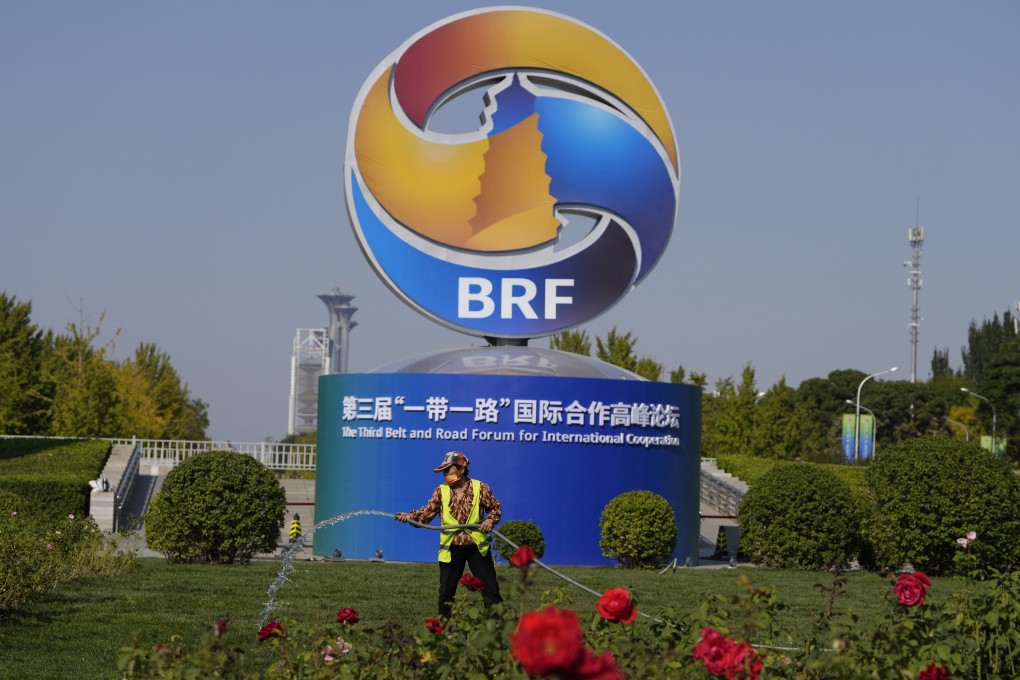 A gardener at work under a Belt and Road Forum installation in Beijing in late 2023. Years of funding and building megaprojects under its multibillion-dollar Belt and Road Initiative has also seen China build a positive view of itself among the African people. Photo: AP