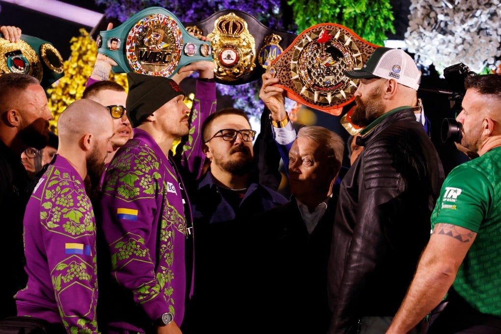 Oleksandr Usyk (left) and Tyson Fury face off during the weigh-in. Photo: Reuters