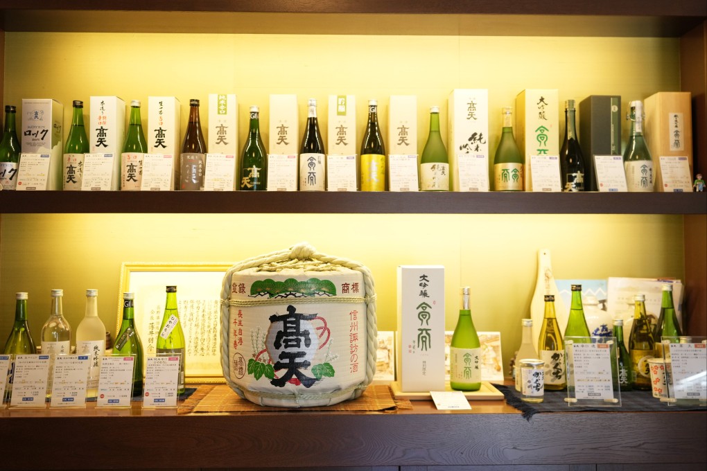 Bottles of Japanese sake brands on display at a store in Okaya, Nagano prefecture. Photo: AP