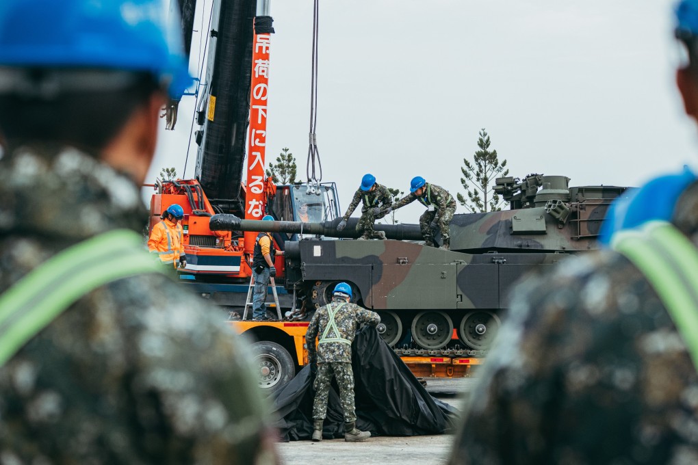 Taiwanese troops inspect US-made tanks as they arrive at an army base in Hsinchu, northern Taiwan, on December 16. The tanks were ordered in 2019, according to Taipei. Photo: EPA-EFE