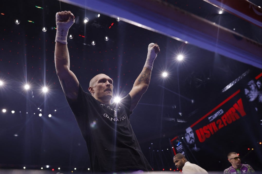 Oleksandr Usyk celebrates after beating Tyson Fury for the second time. Photo: Reuters