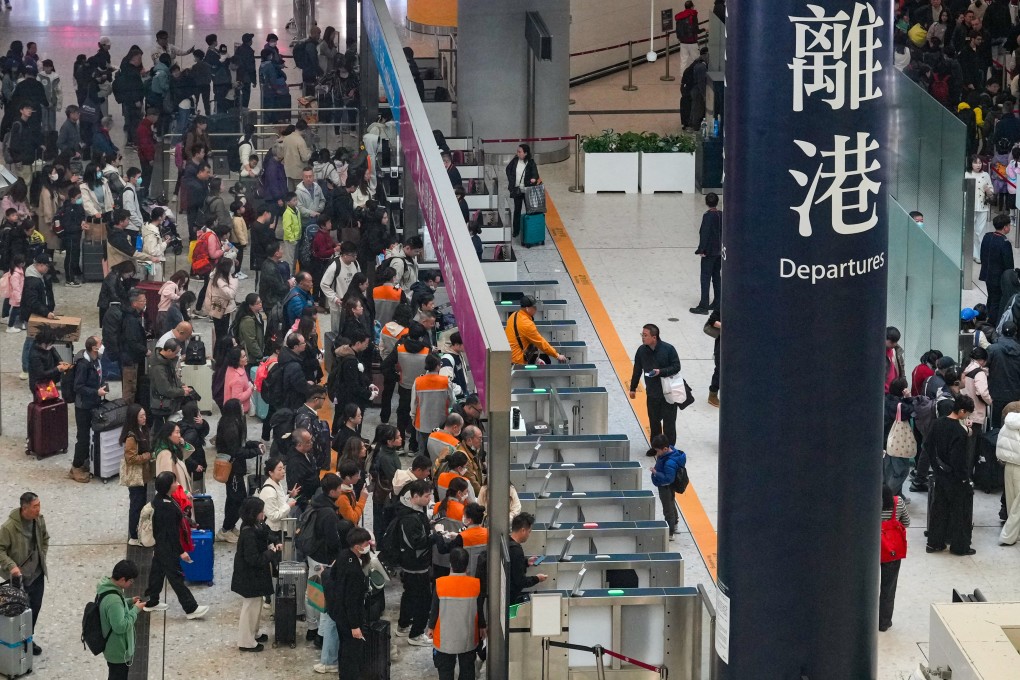 Travelers at the departure hall of West Kowloon railway station on December 22. Photo: May Tse