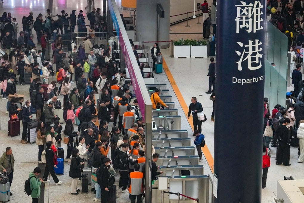 Travelers at the departure hall of West Kowloon railway station on December 22. Photo: May Tse