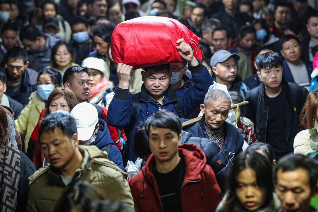 Passengers stream into a train station in central China’s Hunan province during the Lunar New Year travel rush in January 2024. Photo: AFP