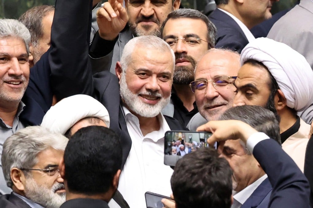 Hamas leader Ismail Haniyeh, centre, in Tehran, Iran on July 30. He was assassinated the following day. Photo: EPA-EFE