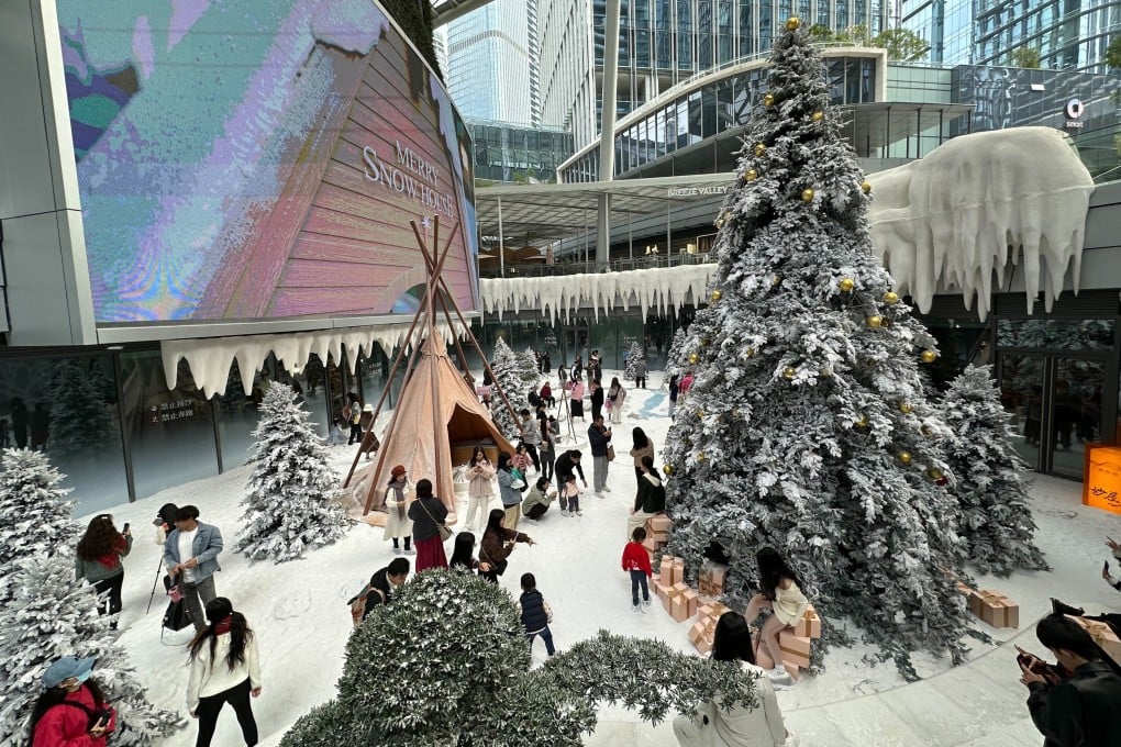 Visitors enjoy the Christmas snowscape at MixC World shopping centre. Photo: Oscar Liu