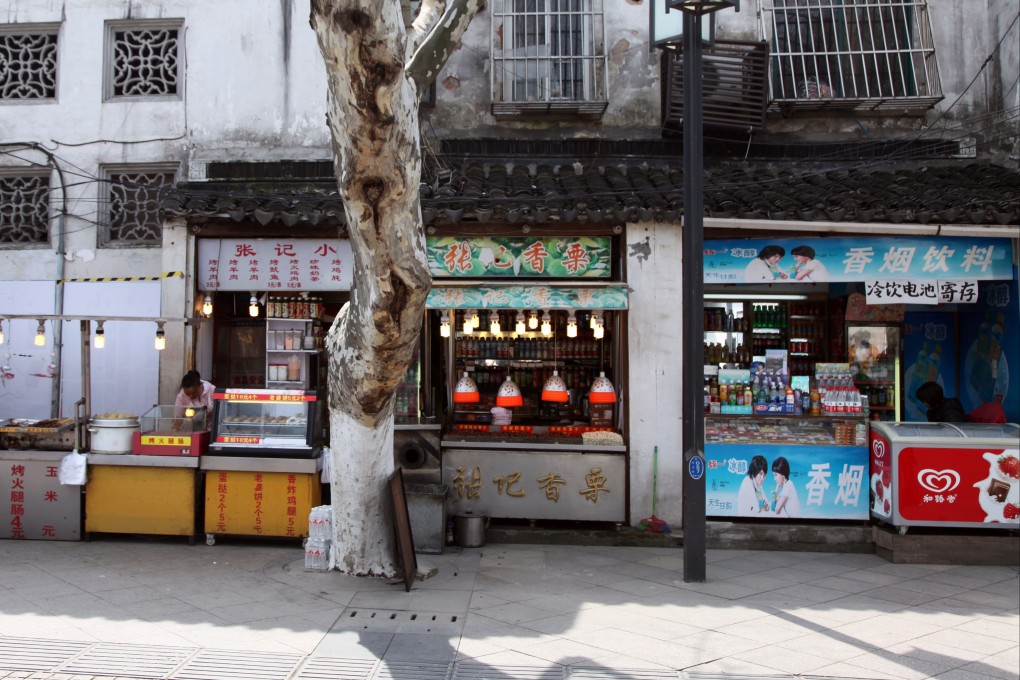 A deserted commercial street in Suzhou, Jiangsu province. Small businesses across China have been badly affected by a slowdown in consumption this year. Photo: Shutterstock