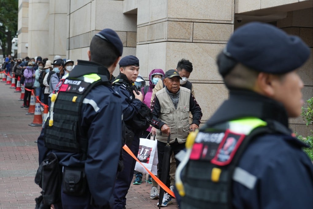 People queue up to enter the West Kowloon Law Courts Building to hear Jimmy Lai’s national security trial in November. Photo: Sam Tsang