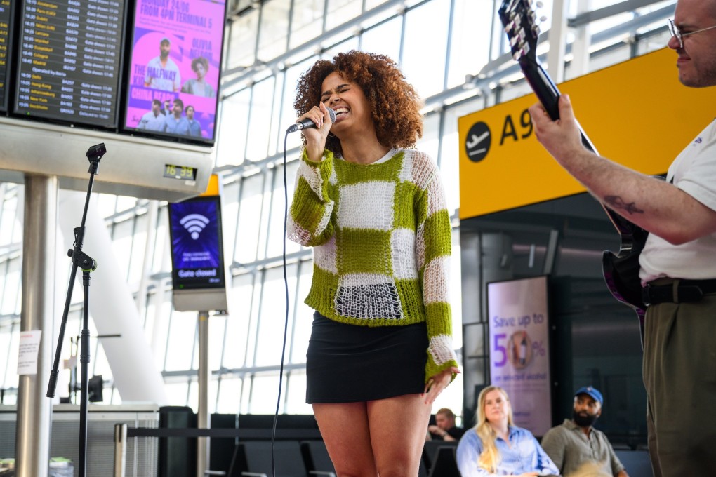 RnB artist Olivia Nelson performs to passengers in the first of a series of surprise gigs at Terminal 5 at London’s Heathrow Airport on June 25, 2024. Photo: Matt Crossick/PA Media Assignments