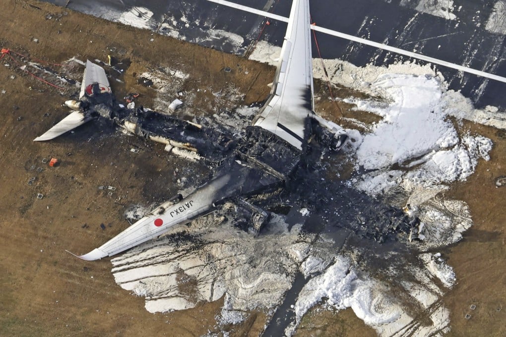 The burnt-out Japan Airlines plane at Haneda airport in Tokyo on January 3. Photo: Kyodo News via AP