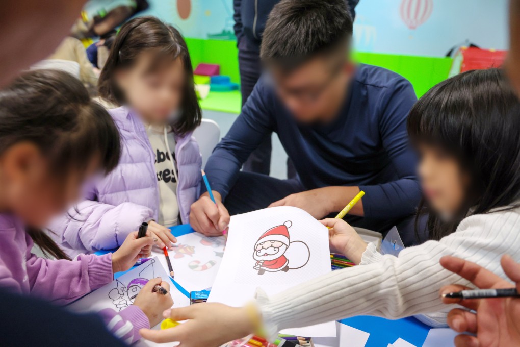 Male inmates interact with their children. Photo: Dickson Lee