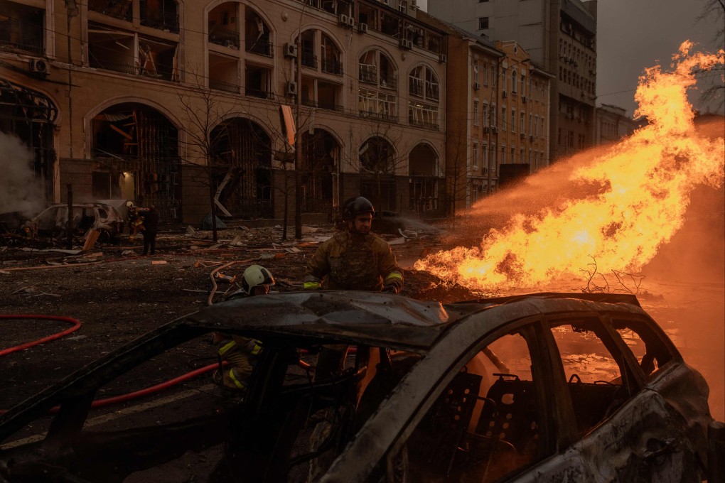 Ukrainian rescuers work to extinguish a fire at the site of a Russian missile attack in Kyiv on December 20. Photo: AFP