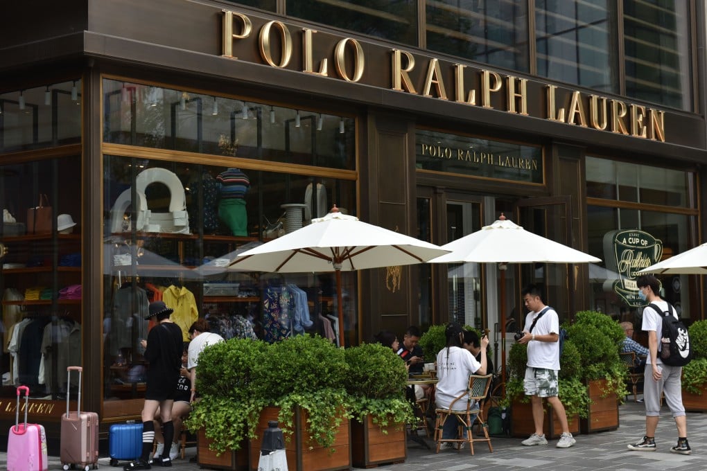 Pedestrians pass in front of the Polo Ralph Lauren store in Beijing in July 2021. Photo: Getty Images
