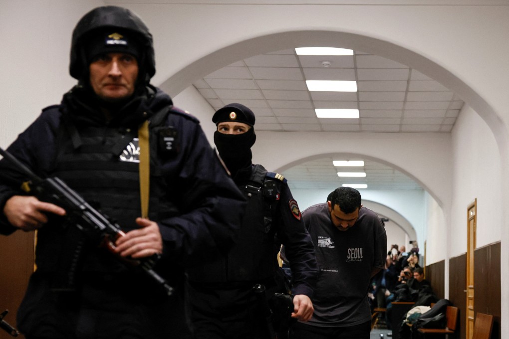 A suspect in the killing of Russian general Igor Kirillov arrives at a court in Moscow on December 19. Photo: Reuters