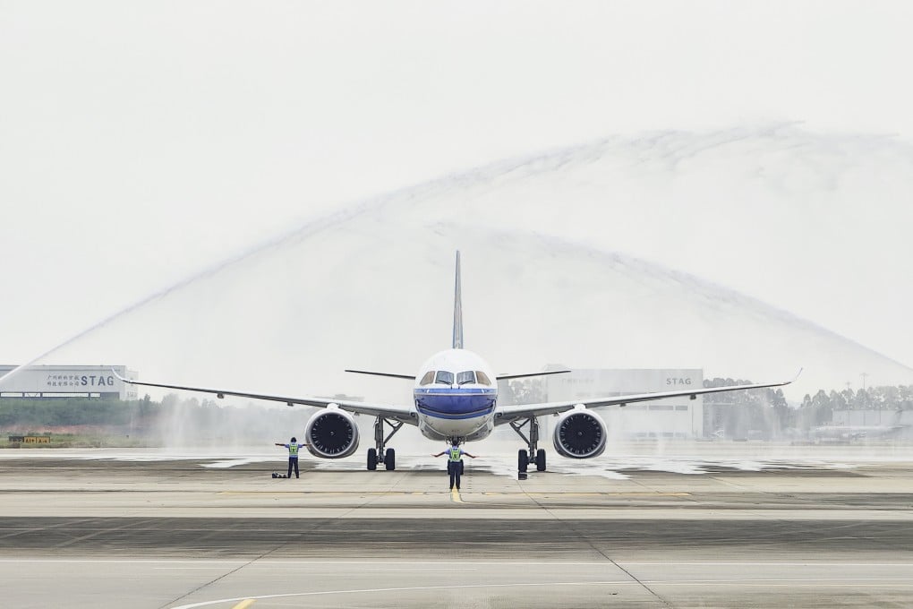China Southern Airlines’ first C919 receives a ceremonial water salute on its arrival at Guangzhou Baiyun International Airport in August. Photo: Xinhua