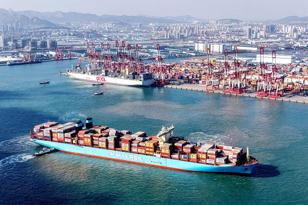 A cargo ship loaded with containers sails from the Qingdao port in eastern China’s Shandong province on Thursday. Photo: AFP