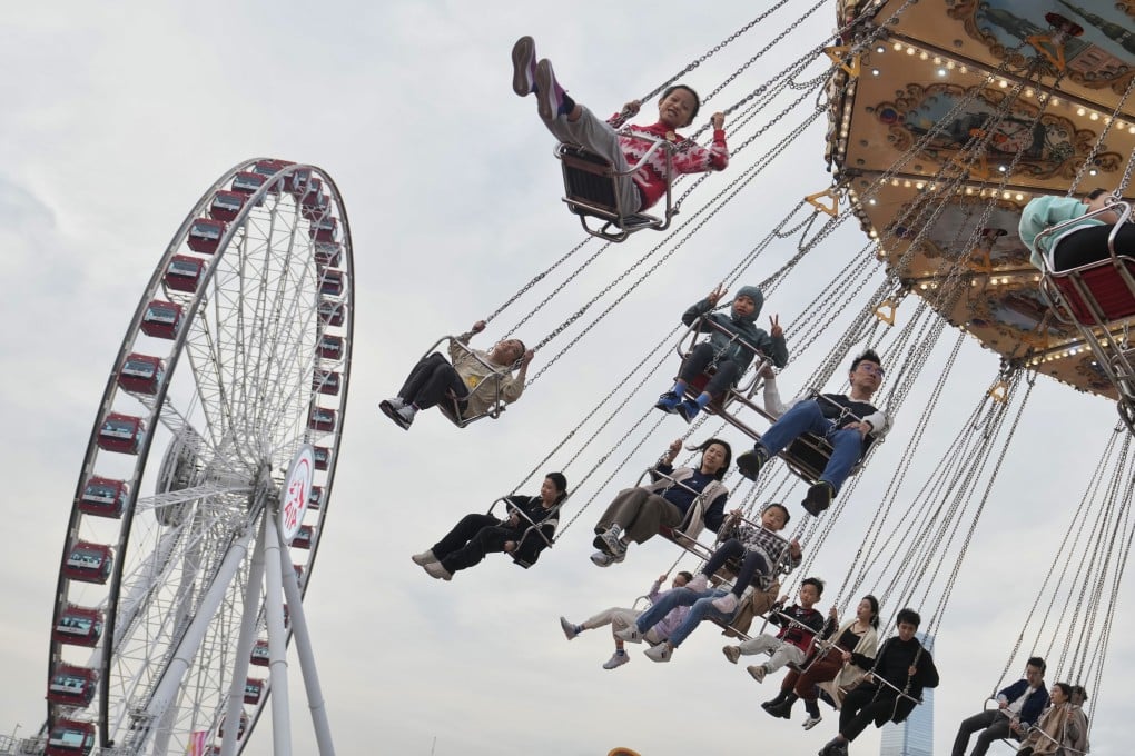 People enjoy a ride at the AIA Carnival on the Central Harbourfront Event Space, one of our picks of the best things to do in Hong Kong on the weekend of December 27-29, 2024. Photo: Elson Li