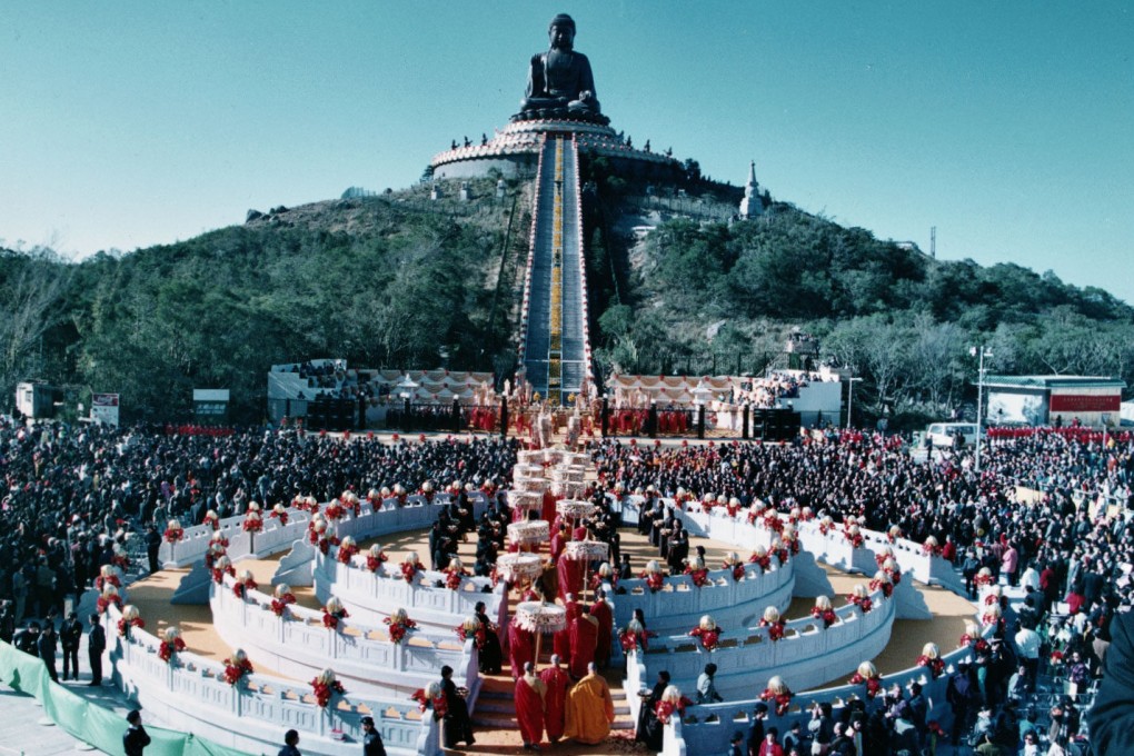 A procession of monks moves through the crowd of 10,000 who attended the colourful inauguration ceremony for the giant Tian Tan Buddha on Lantau Island. Photo: Martin Chan