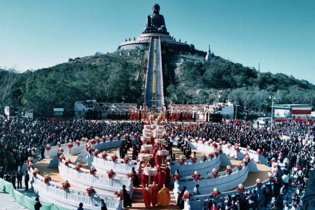 A procession of monks moves through the crowd of 10,000 who attended the colourful inauguration ceremony for the giant Tian Tan Buddha on Lantau Island. Photo: Martin Chan