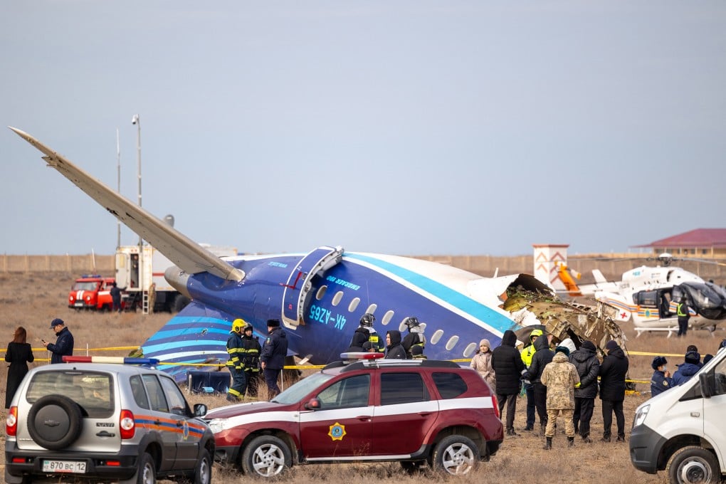 Emergency specialists work at the crash site of an Azerbaijan Airlines jet near the Kazakh city of Aktau on December 25. Photo: AFP/Getty Images/TNS
