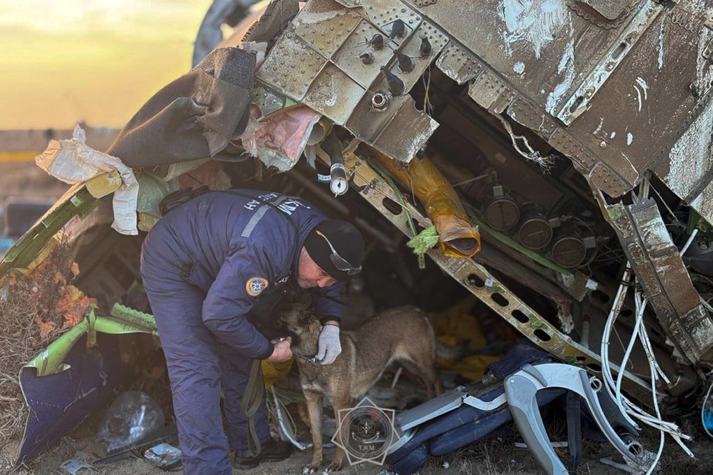 A rescuer searches at the wreckage of the crashed Azerbaijan Airlines plane in Aktau, Kazakhstan, on December 26. Photo: Kazakhstan’s Emergency Ministry Press Service via AP