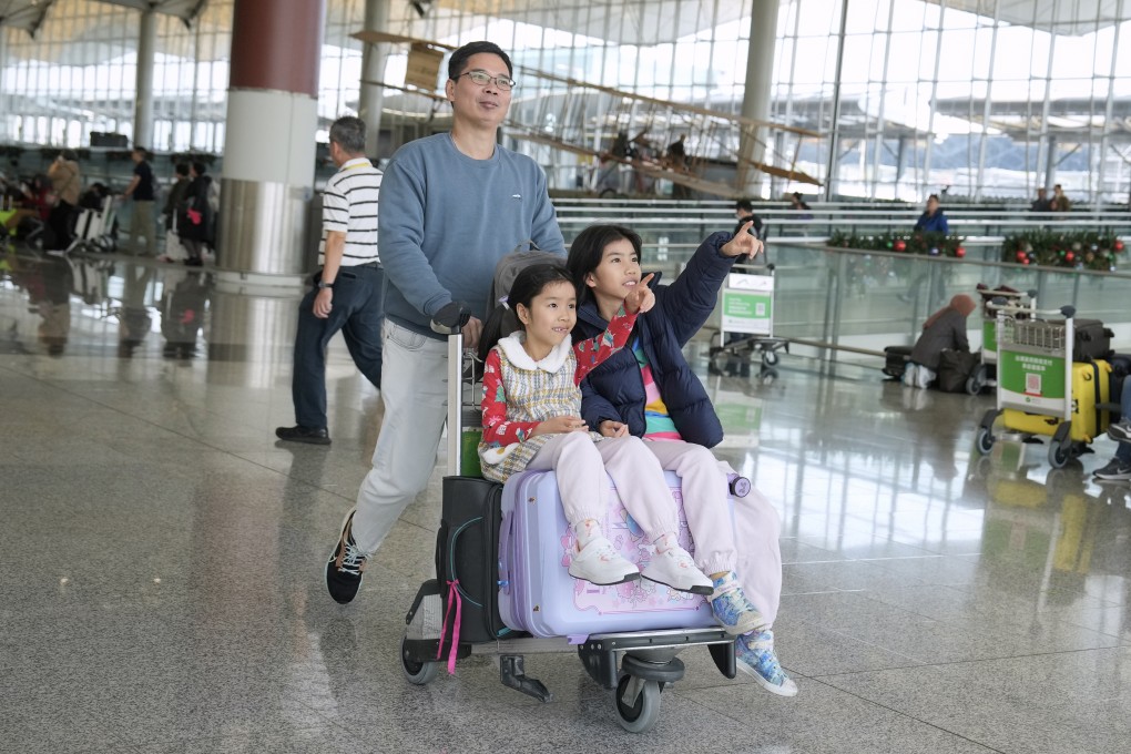 Travellers pass through Hong Kong airport’s departure hall in the run-up to Christmas. Photo: Elson Li