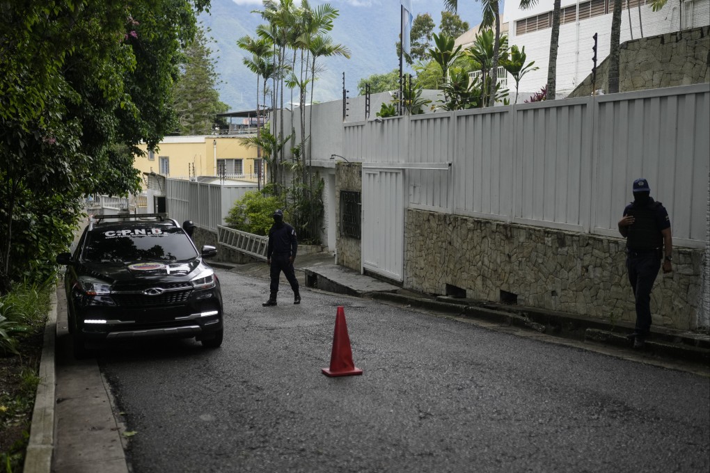 A police patrol car sits parked outside Argentina’s embassy where some members of Venezuela’s opposition are seeking asylum inside, in Caracas, Venezuela. Photo: AP