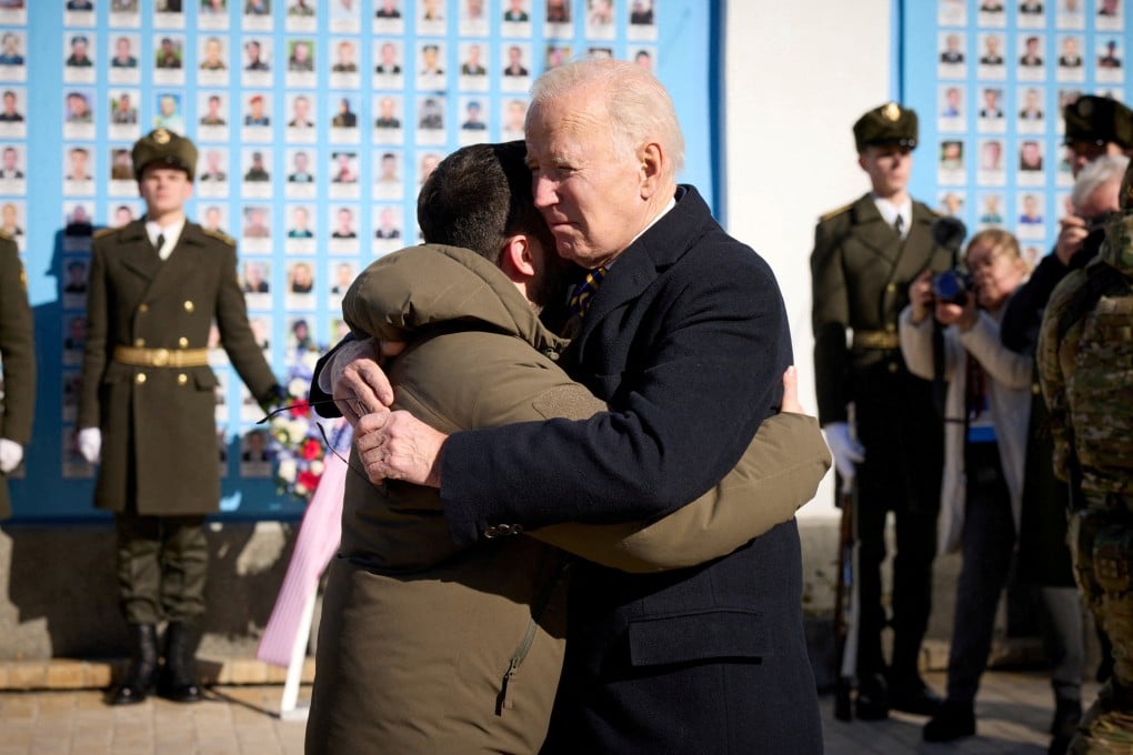US President Joe Biden (right) embraces Ukraine’s President Volodymyr Zelensky as they visit the Wall of Remembrance to pay tribute to killed Ukrainian soldiers in February 2023. The US Congress has approved US$175 billion in total assistance for Ukraine since the start of the war nearly 3 years ago. Photo: Reuters