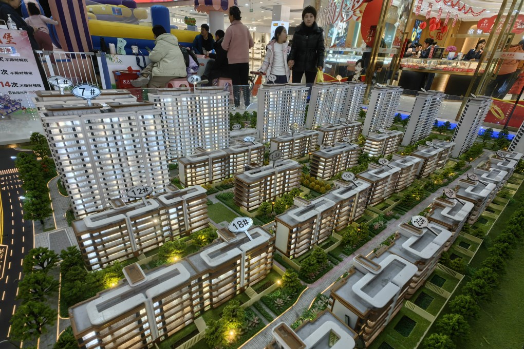 Prospective buyers at a property booth inside a shopping mall in Binzhou, China on December 22, 2024. Photo: Getty Images